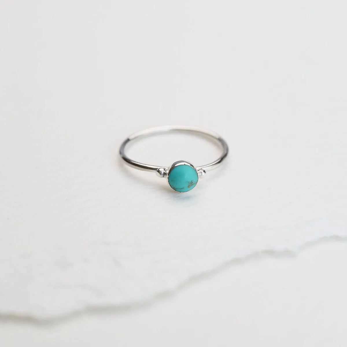 Delicate Compressed Turquoise Round Silver Ring