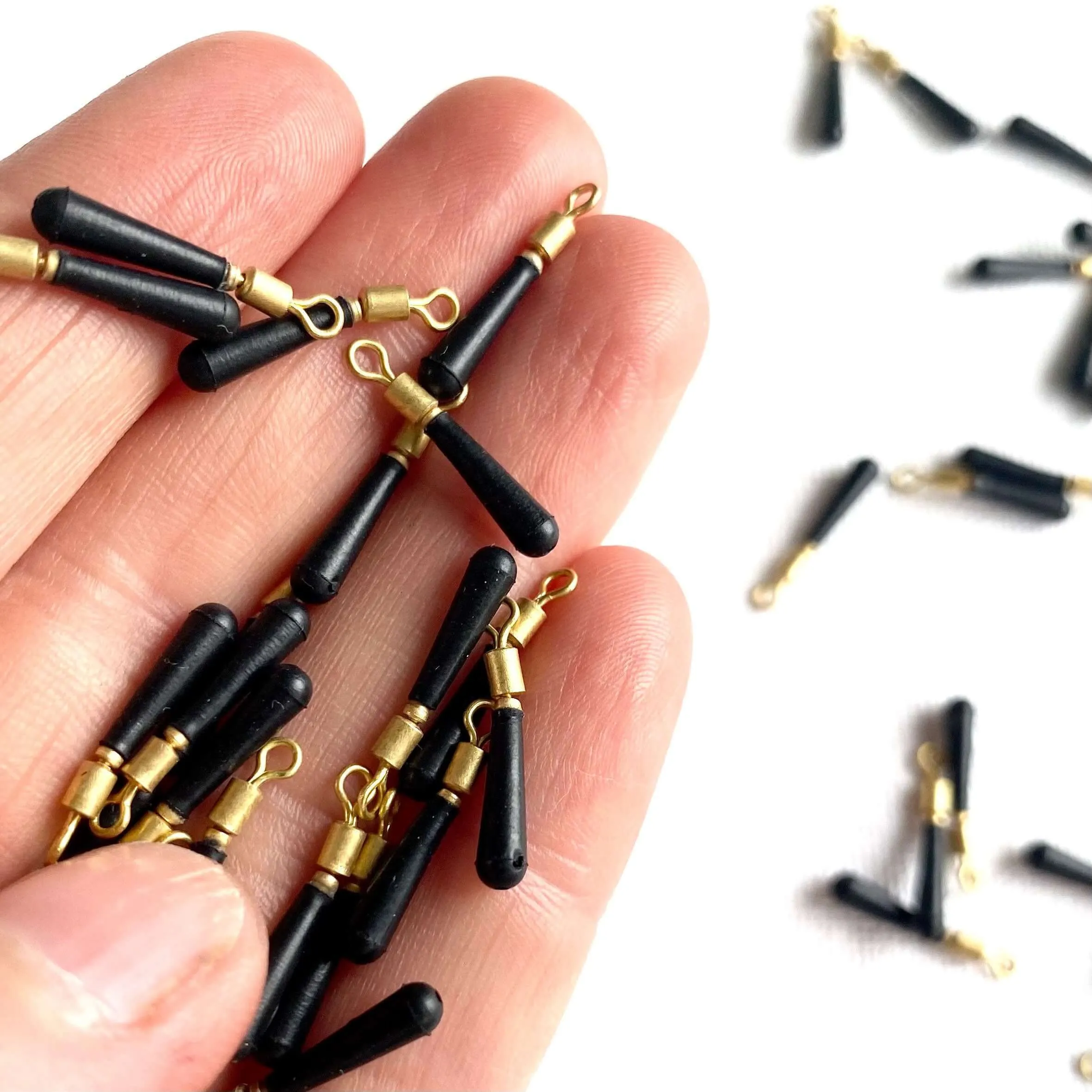 Tiny black rubber tear drop pendants