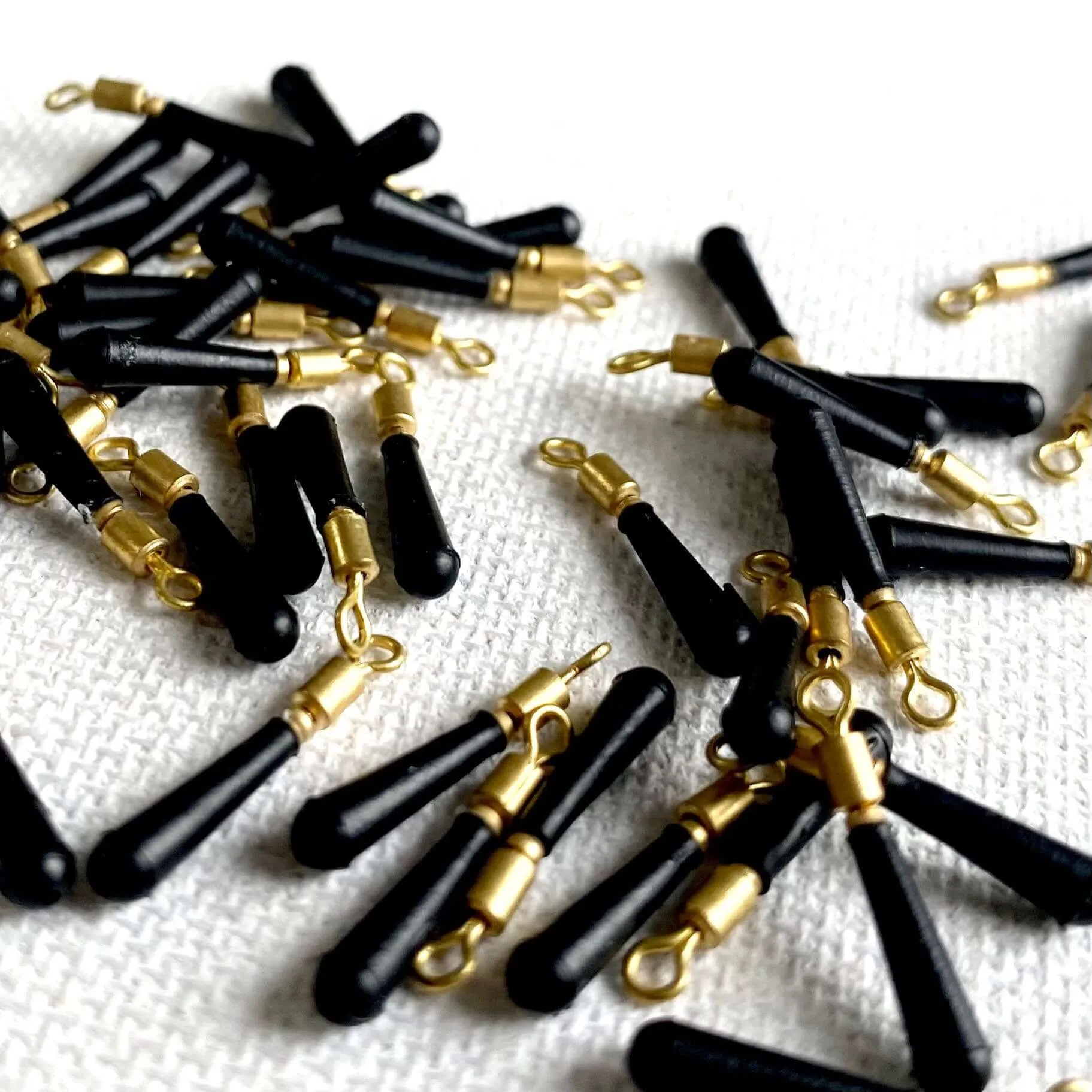 Tiny black rubber tear drop pendants